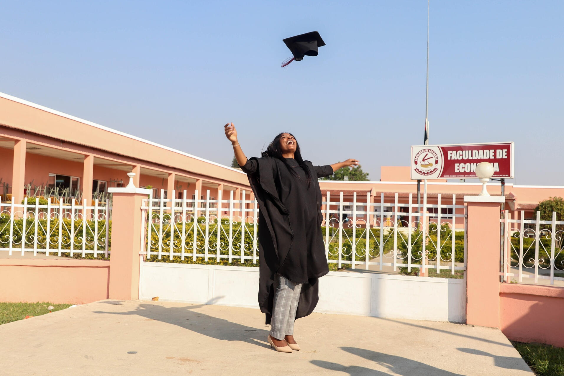 happy graduate throwing cap in the air happy graduate throwing cap in the air